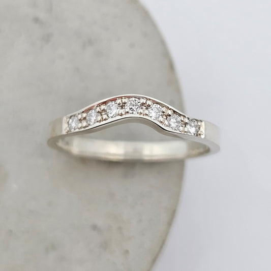 white gold curved shaped fitted diamond set ladies wedding ring