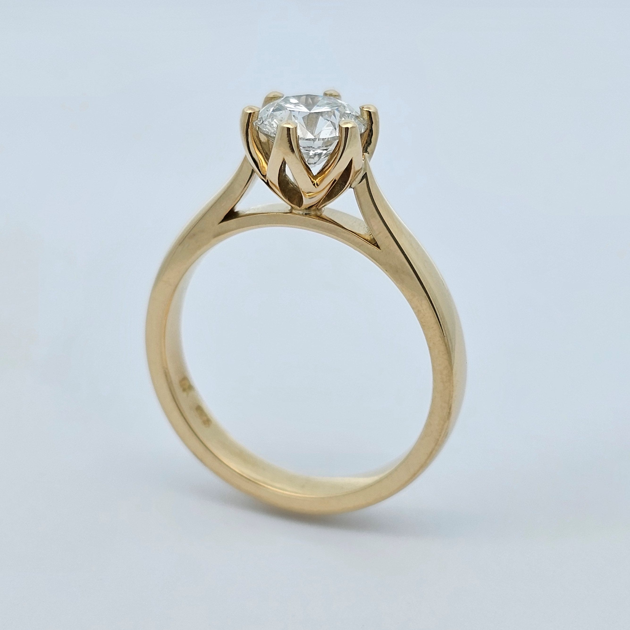 yellow gold round brilliant cut diamond claw-set solitaire engagement ring