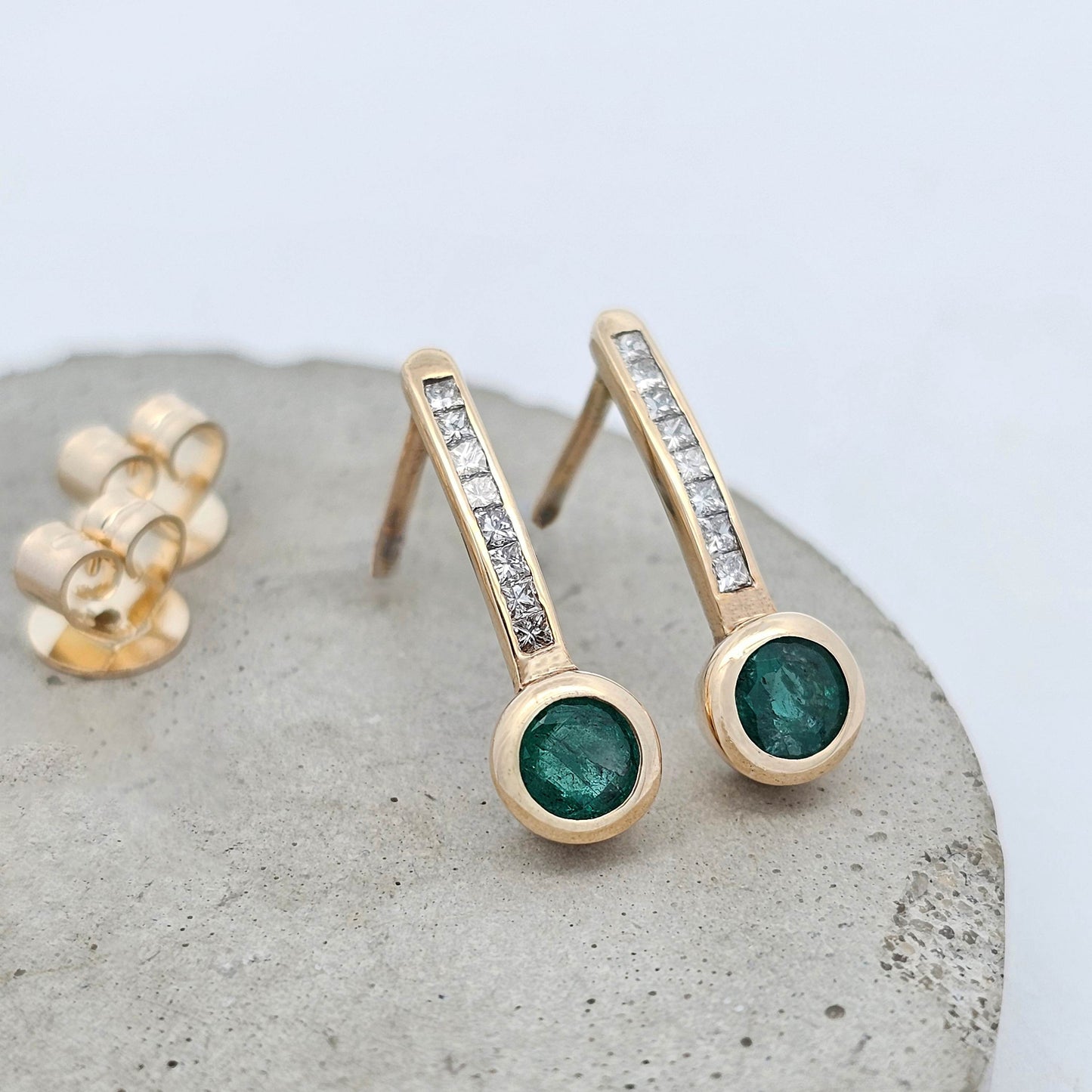 9ct yellow gold natural emerald earrings with princess cut channel set diamonds