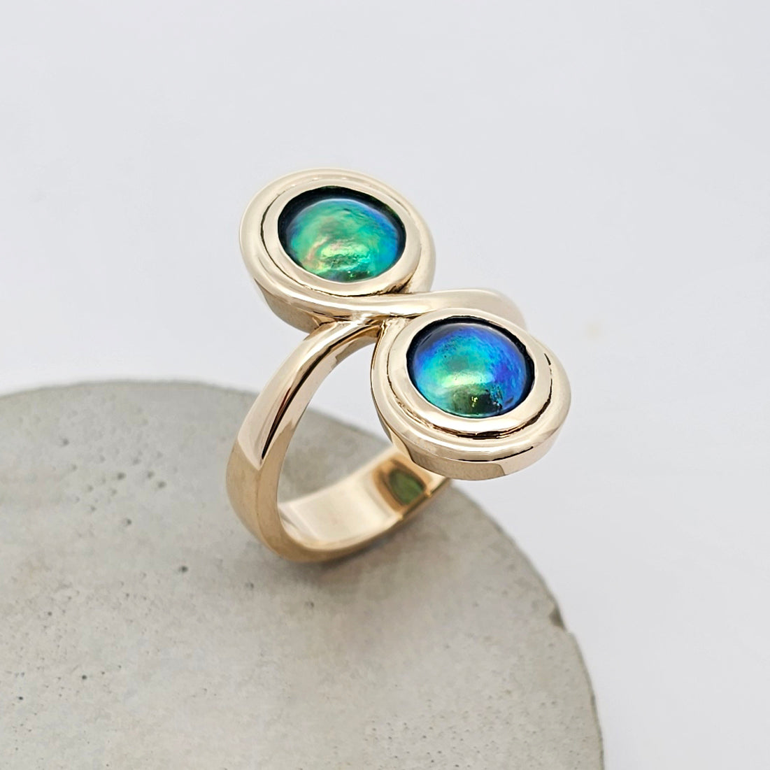 9ct yellow gold ladies dress ring with two round paua pearls set in an infinity design.