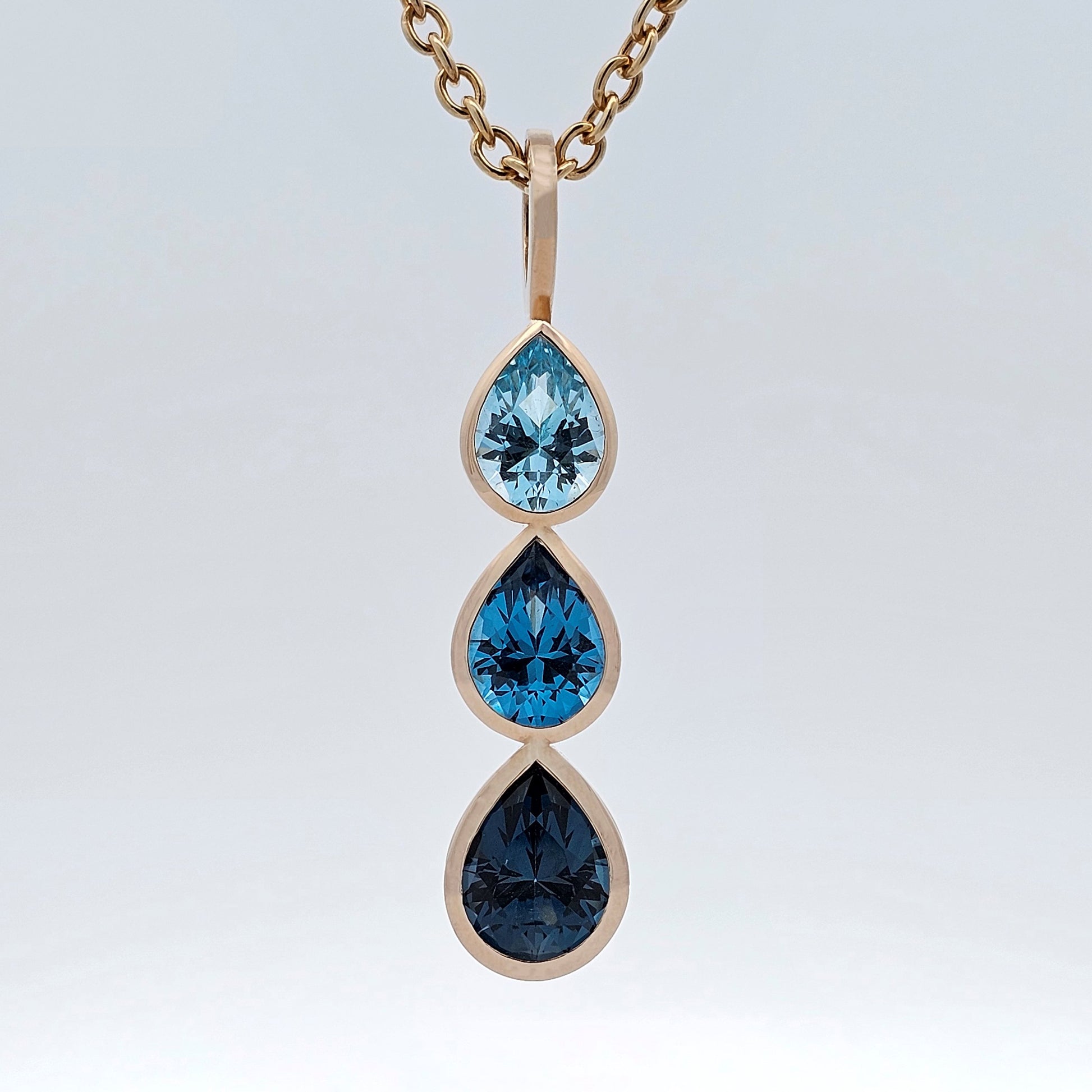 yellow gold blue topaz raindrop pendant