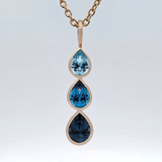 yellow gold blue topaz raindrop pendant