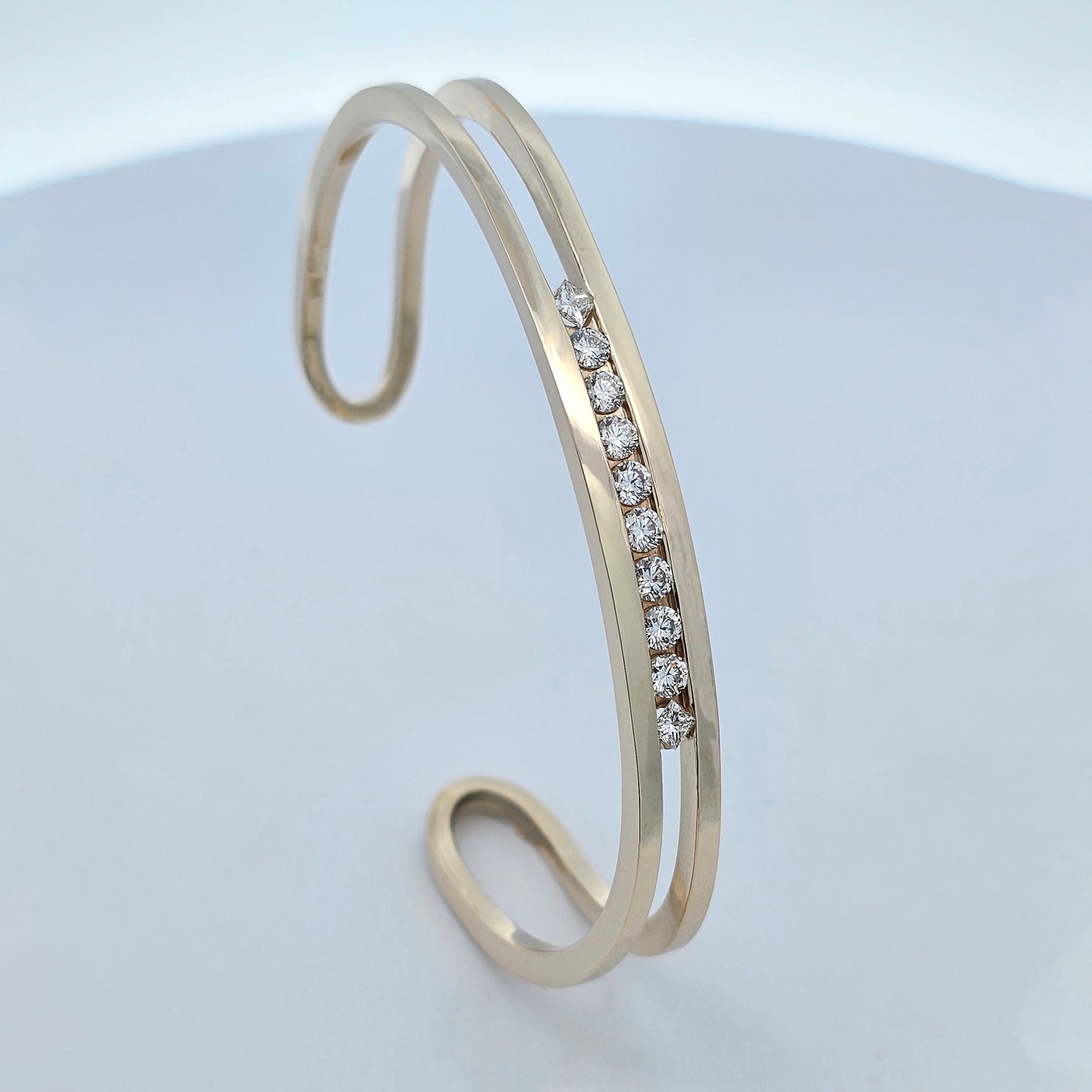 yellow gold channel set one carat diamond fitted cuff bangle