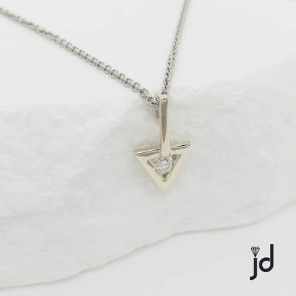 9ct white gold triangular shaped pendant with a long straight bale , set with a sparkling white round diamond and suspended from a simple white gold cable chain.