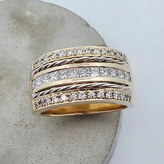 9ct yellow ad white gold wide ladies dress ring, featuring two rows of bead set round white diamonds, one row of channel set princess cut diamonds and two rows of twisted round gold wire.
