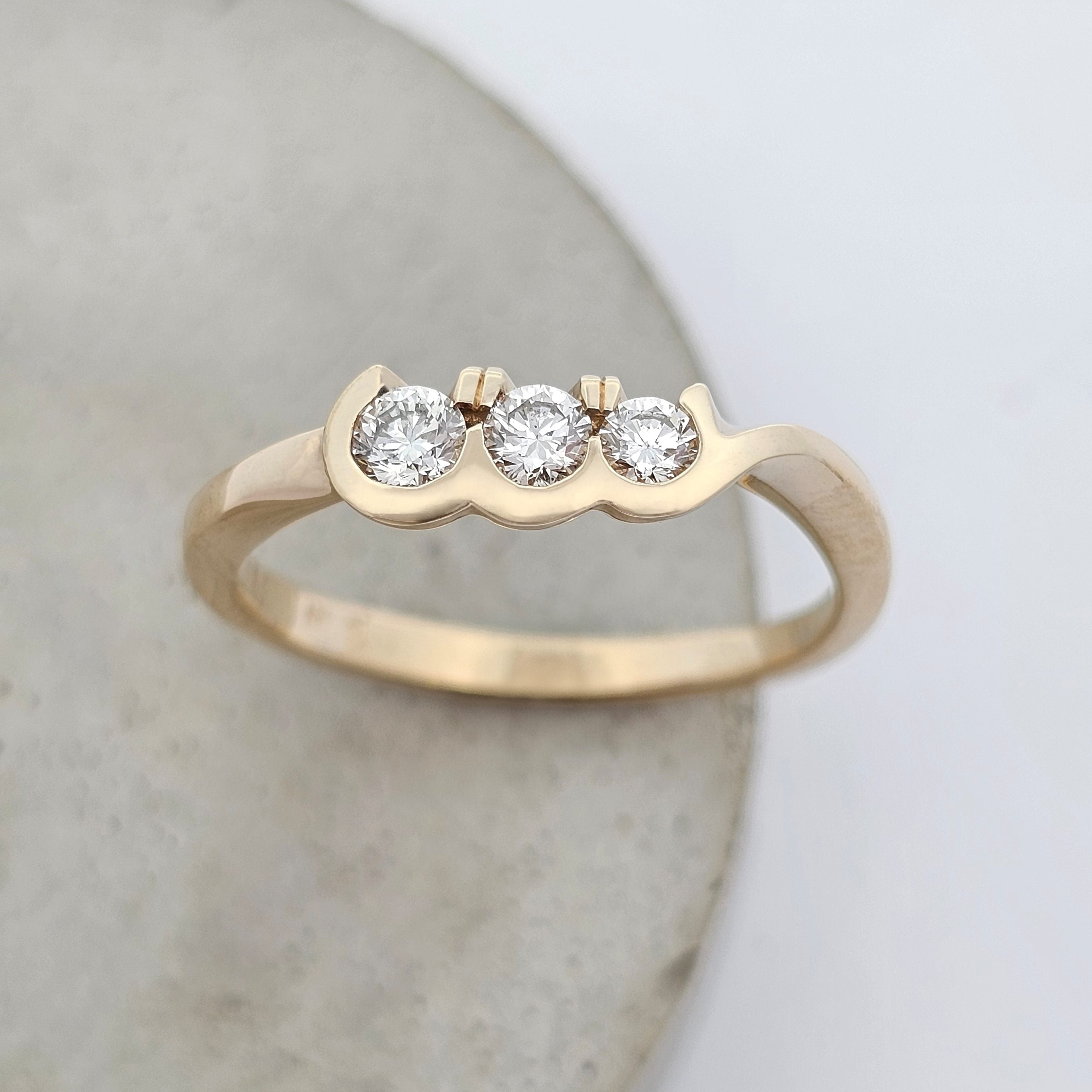yellow gold three stone diamond ring 