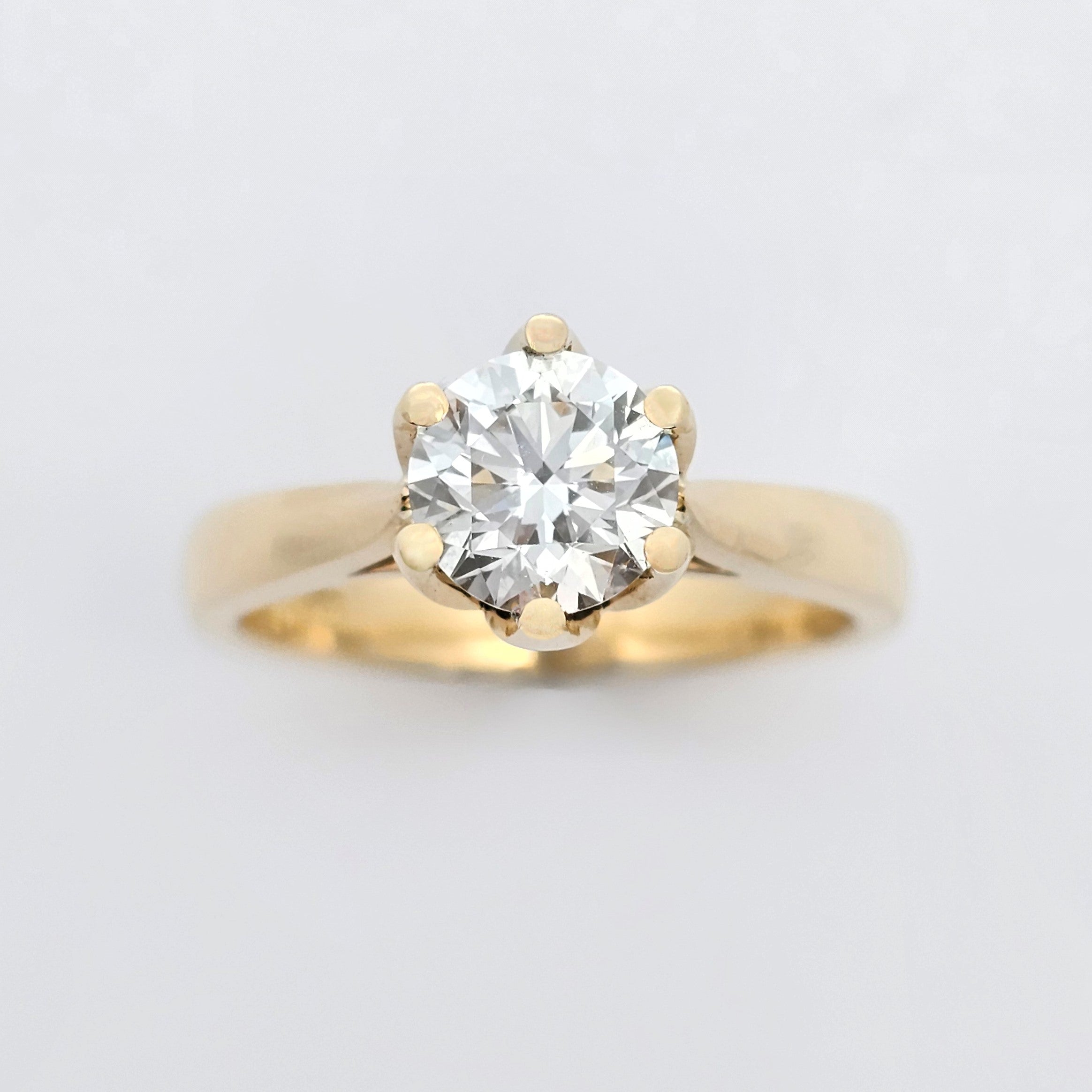 yellow gold round brilliant cut diamond claw-set solitaire engagement ring
