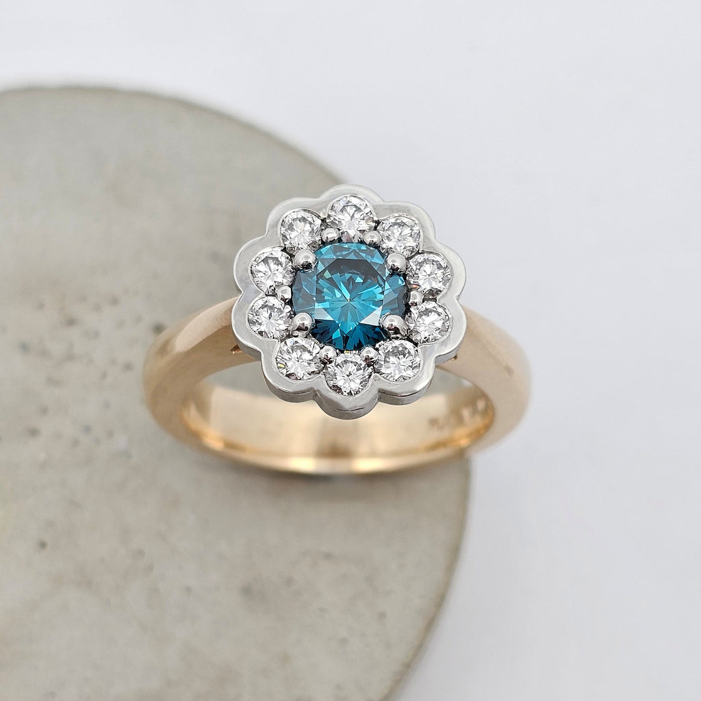 Ocean Bloom 1.005ct blue Sea Diamond ring set it platinum surrounded by natural white diamonds with a 9ct yellow gold band.
