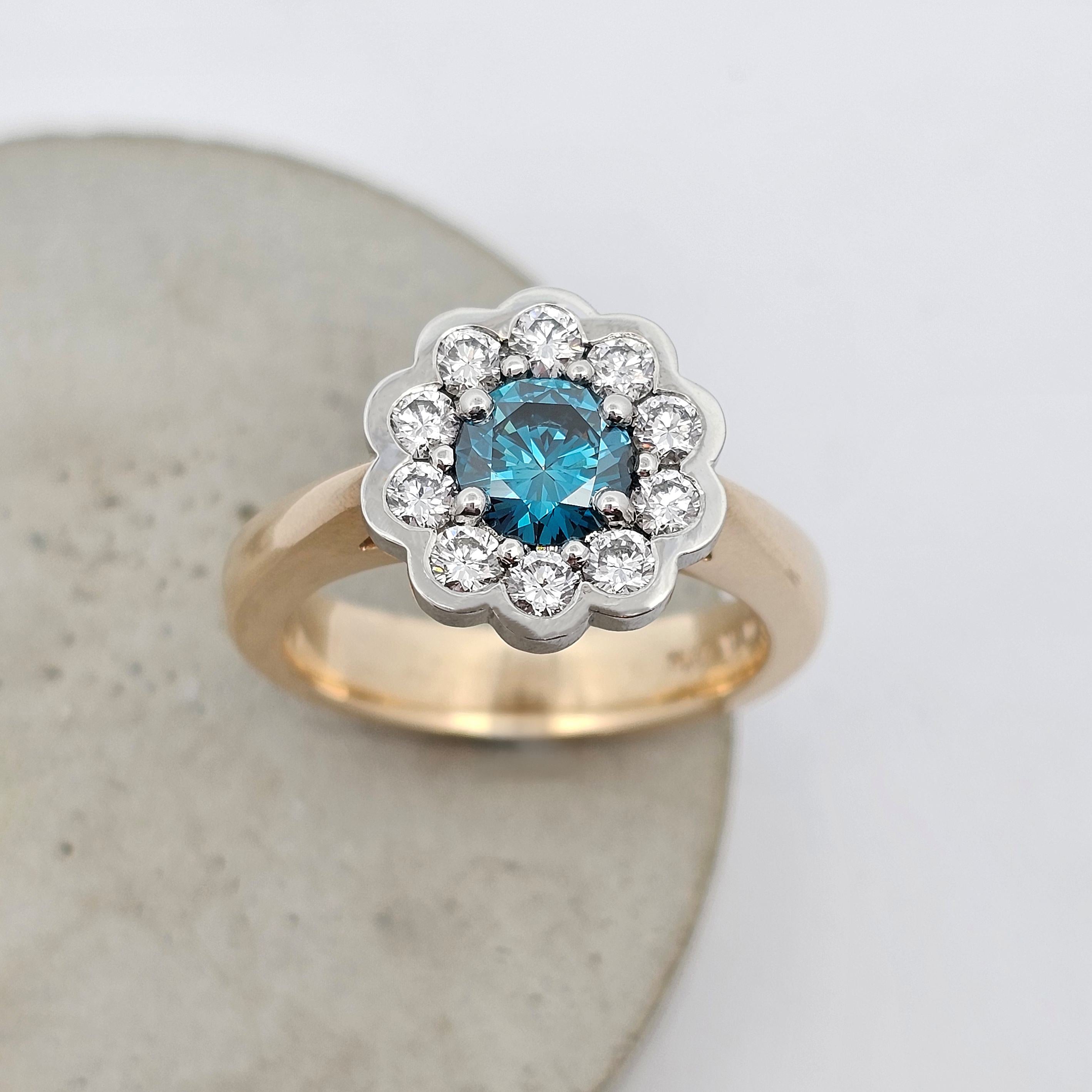 Ocean Bloom 1.005ct blue Sea Diamond ring set it platinum surrounded by natural white diamonds with a 9ct yellow gold band.
