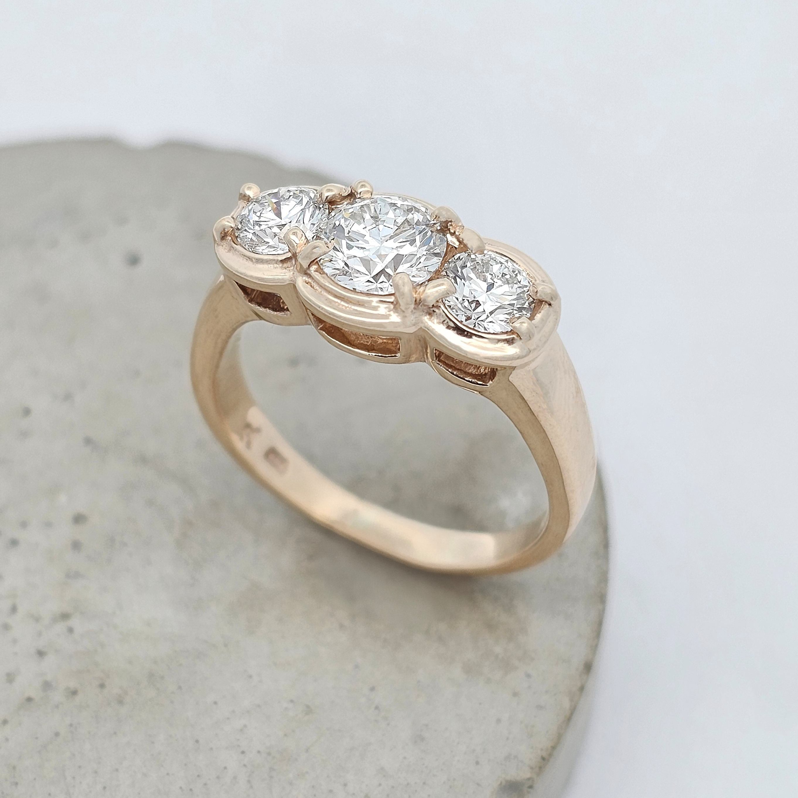 9ct yellow gold trilogy ring featuring three natural round brilliant-cut diamonds in a modern claw-set design.