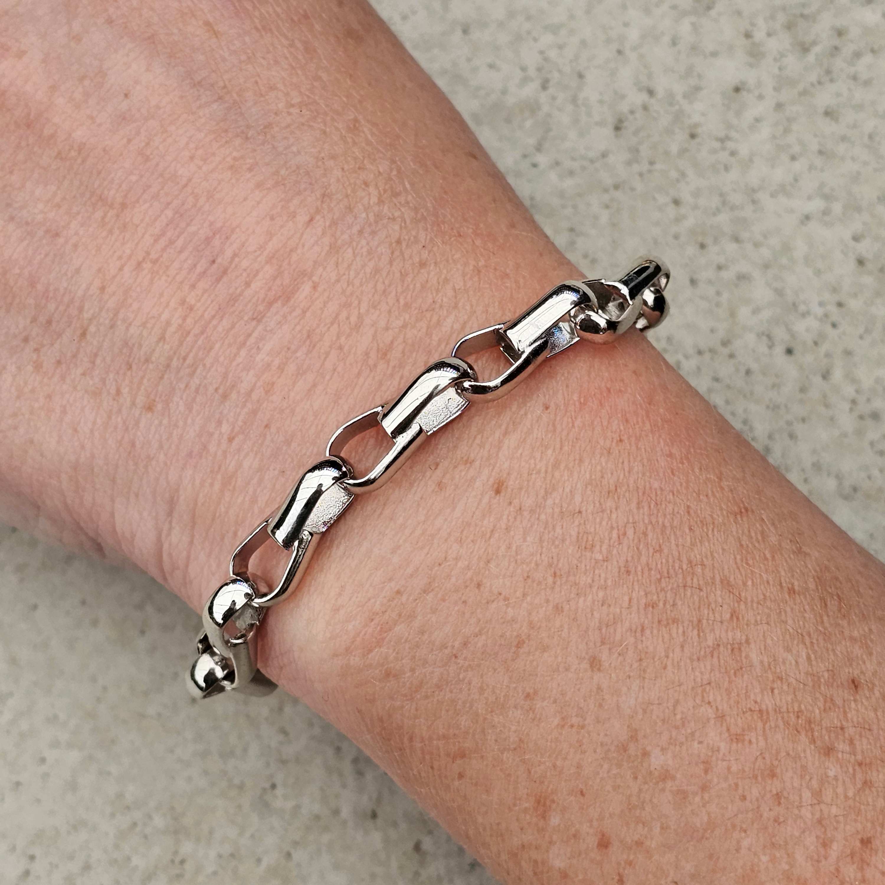 white gold paperlink unique bracelet on wrist