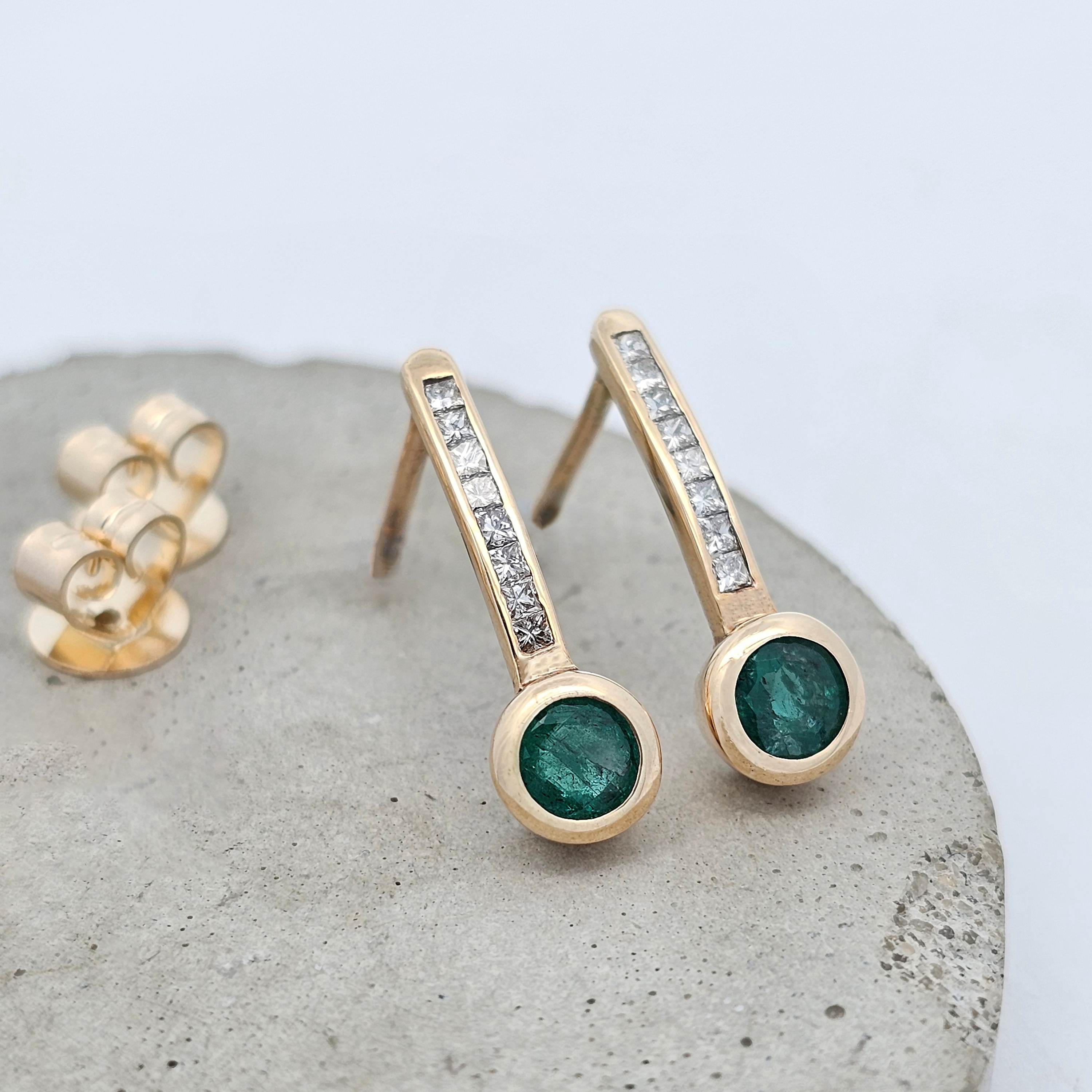 9ct yellow gold natural emerald earrings with princess cut channel set diamonds