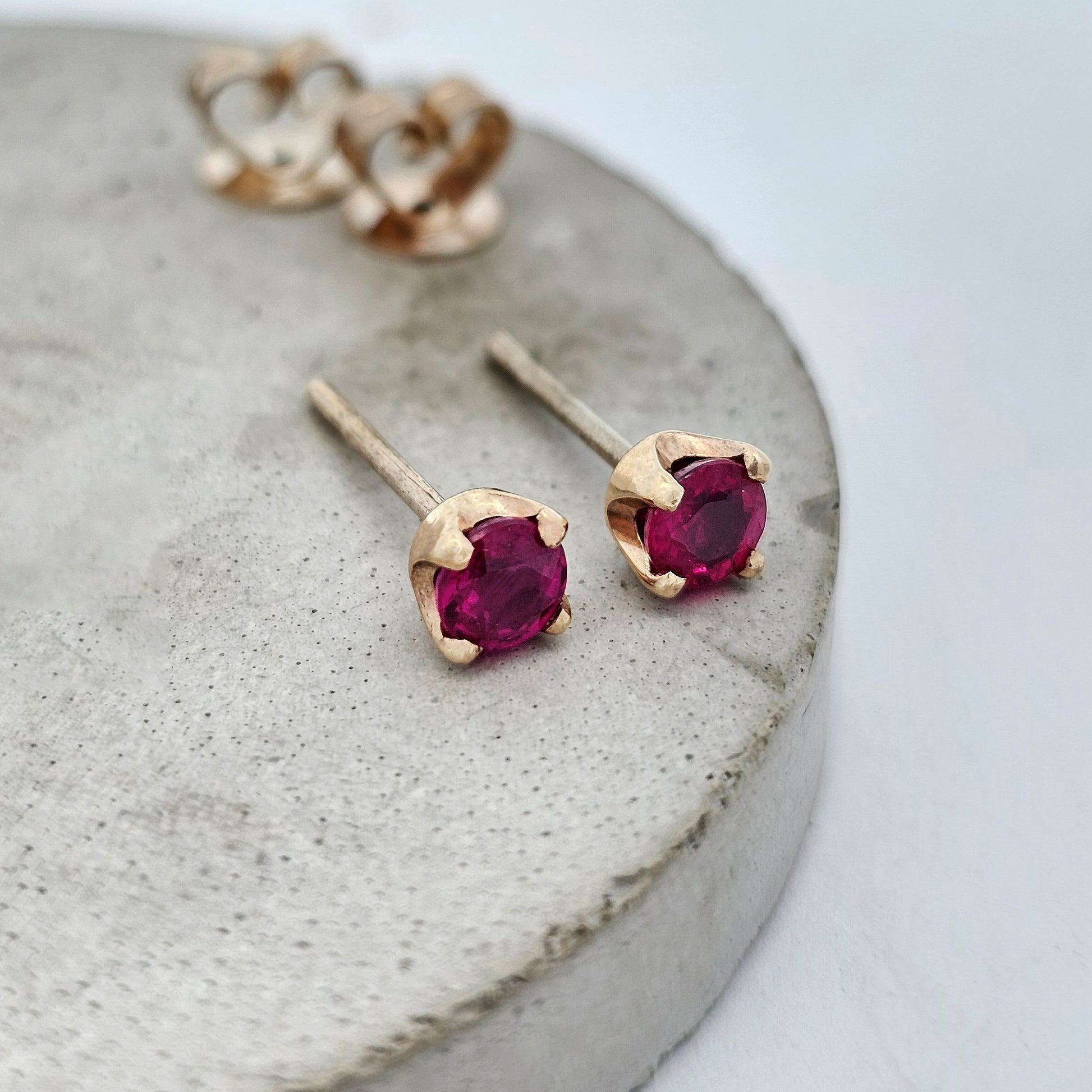 9ct yellow gold claw-set ruby stud earrings
