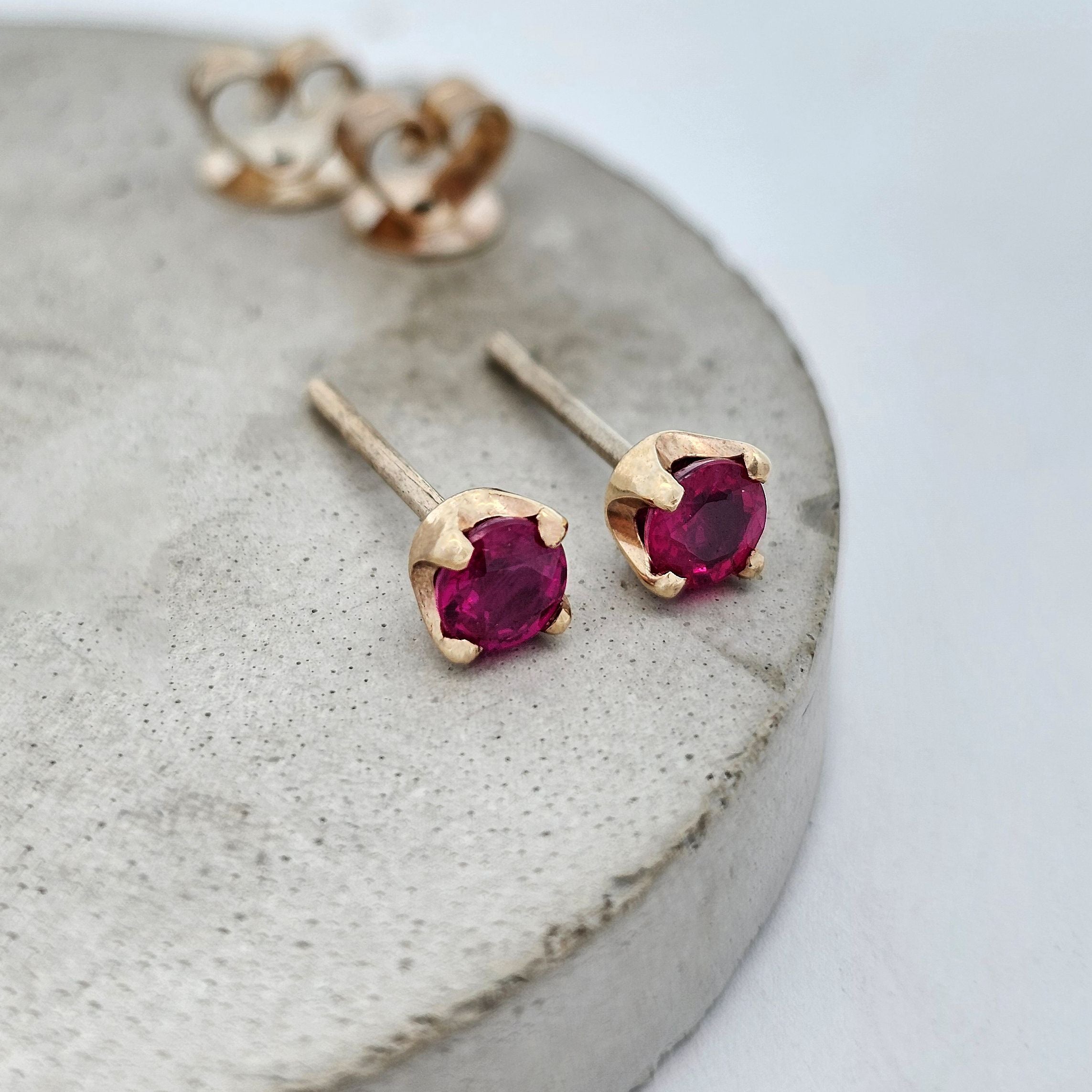 9ct yellow gold claw-set ruby stud earrings