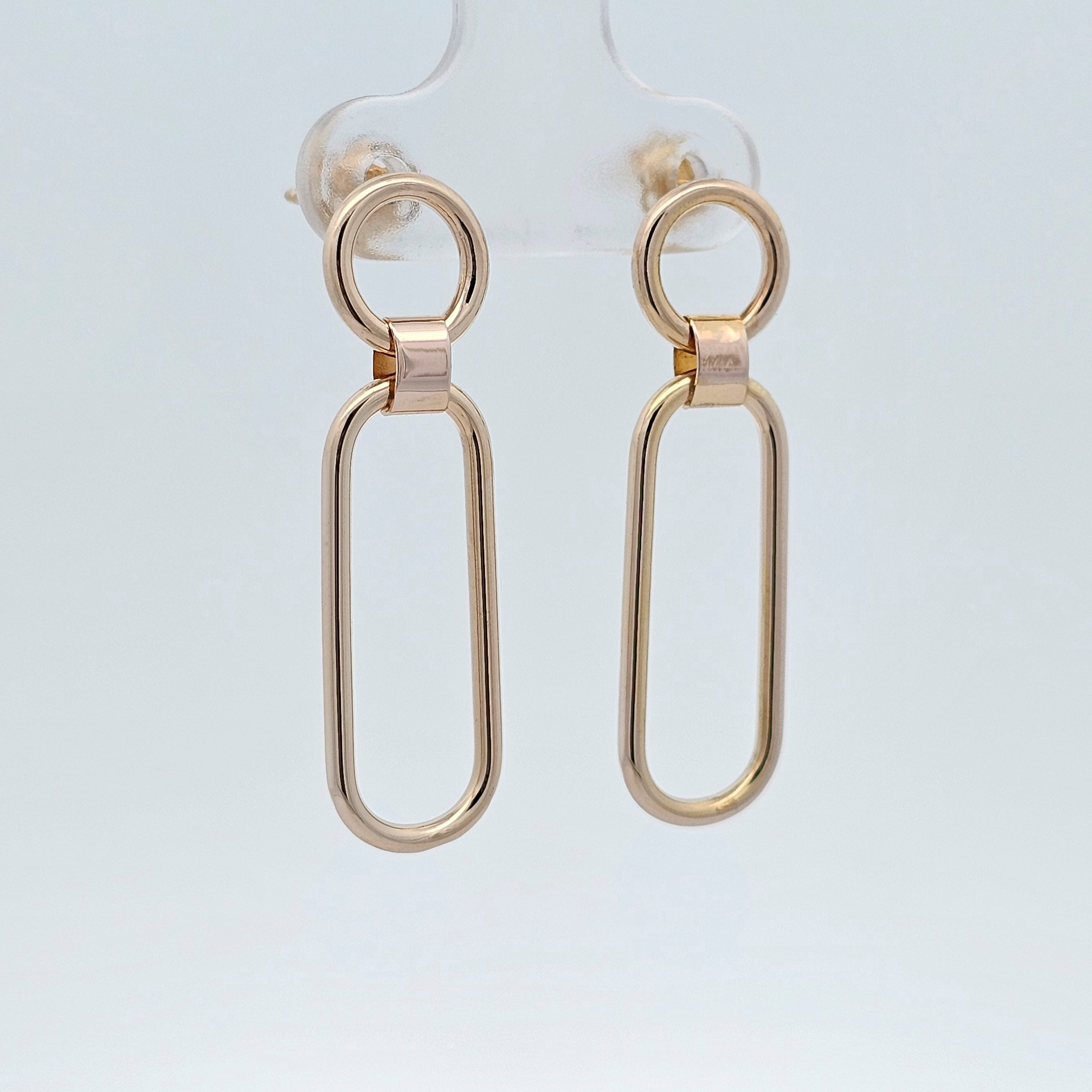 Polished gold elongated link drop earrings with oval links.
