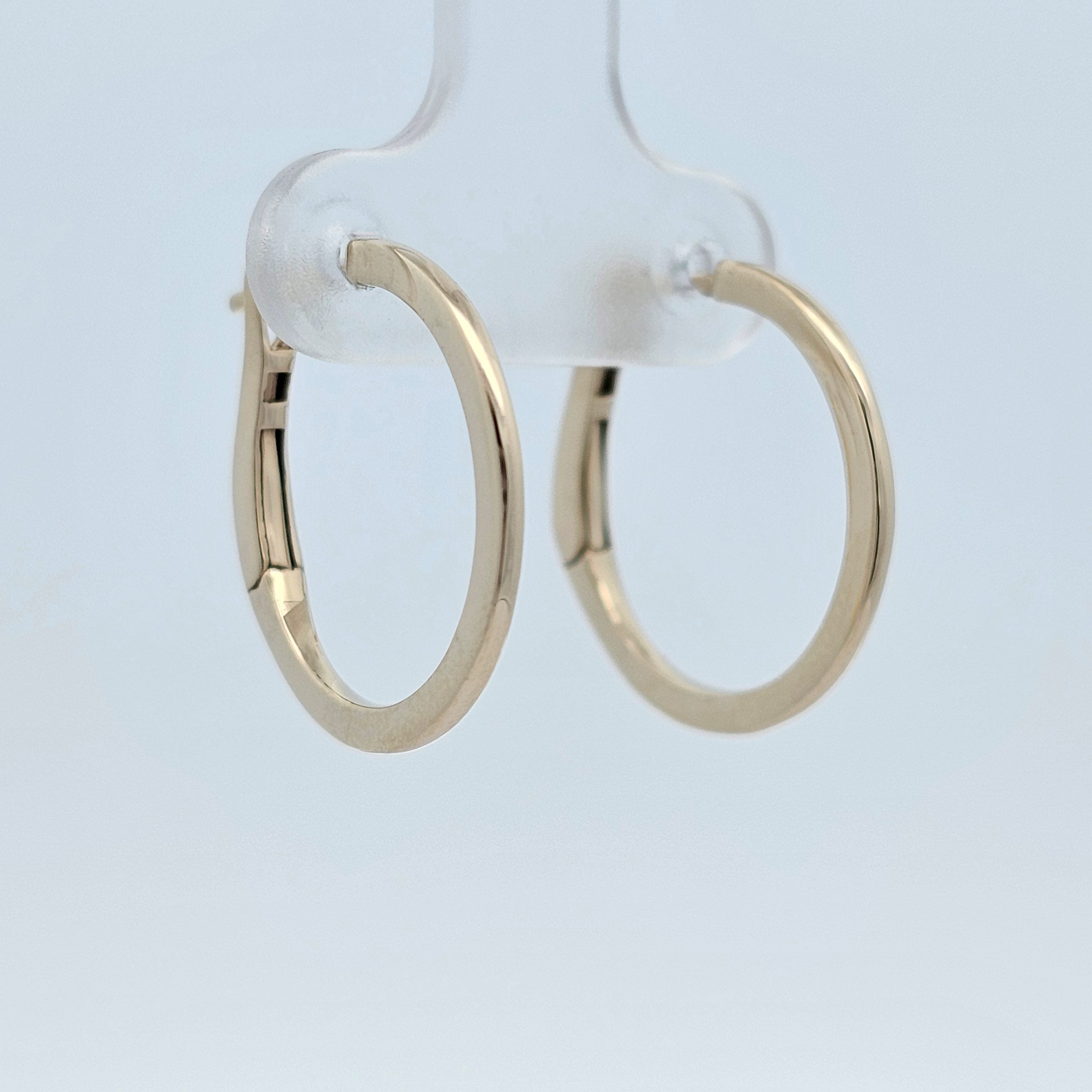 Yellow gold hoop earrings with a smooth polished finish