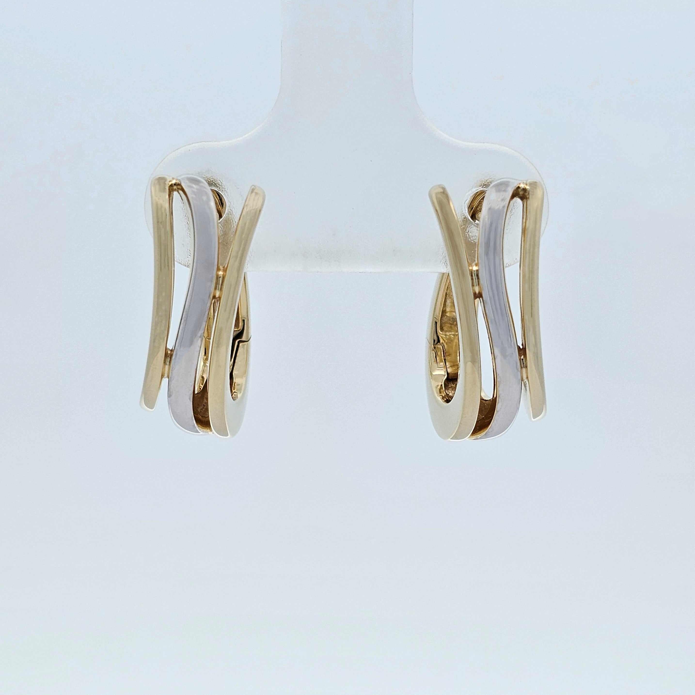 Two-tone gold earrings with layered yellow and white gold curved bands