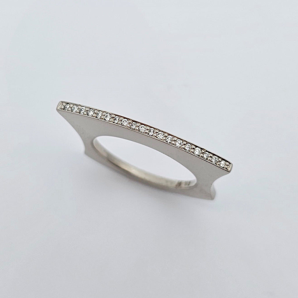 9ct white gold fan shaped ring with a fine line of bead set bright white diamonds.