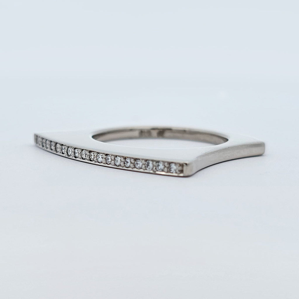 9ct white gold square shaped fan ring with a fine line of bead set bright white diamonds.