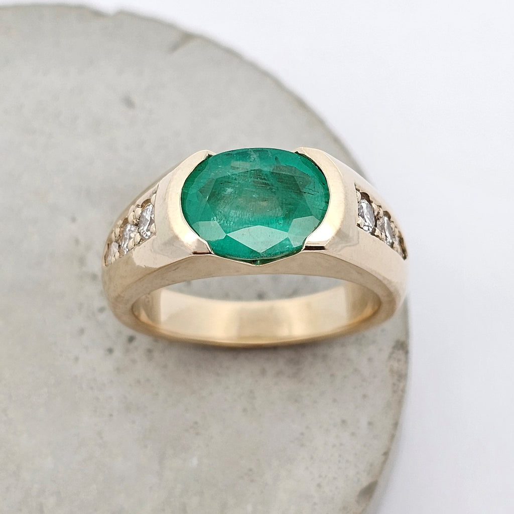 yellow gold emerald and diamond anniversary ring 