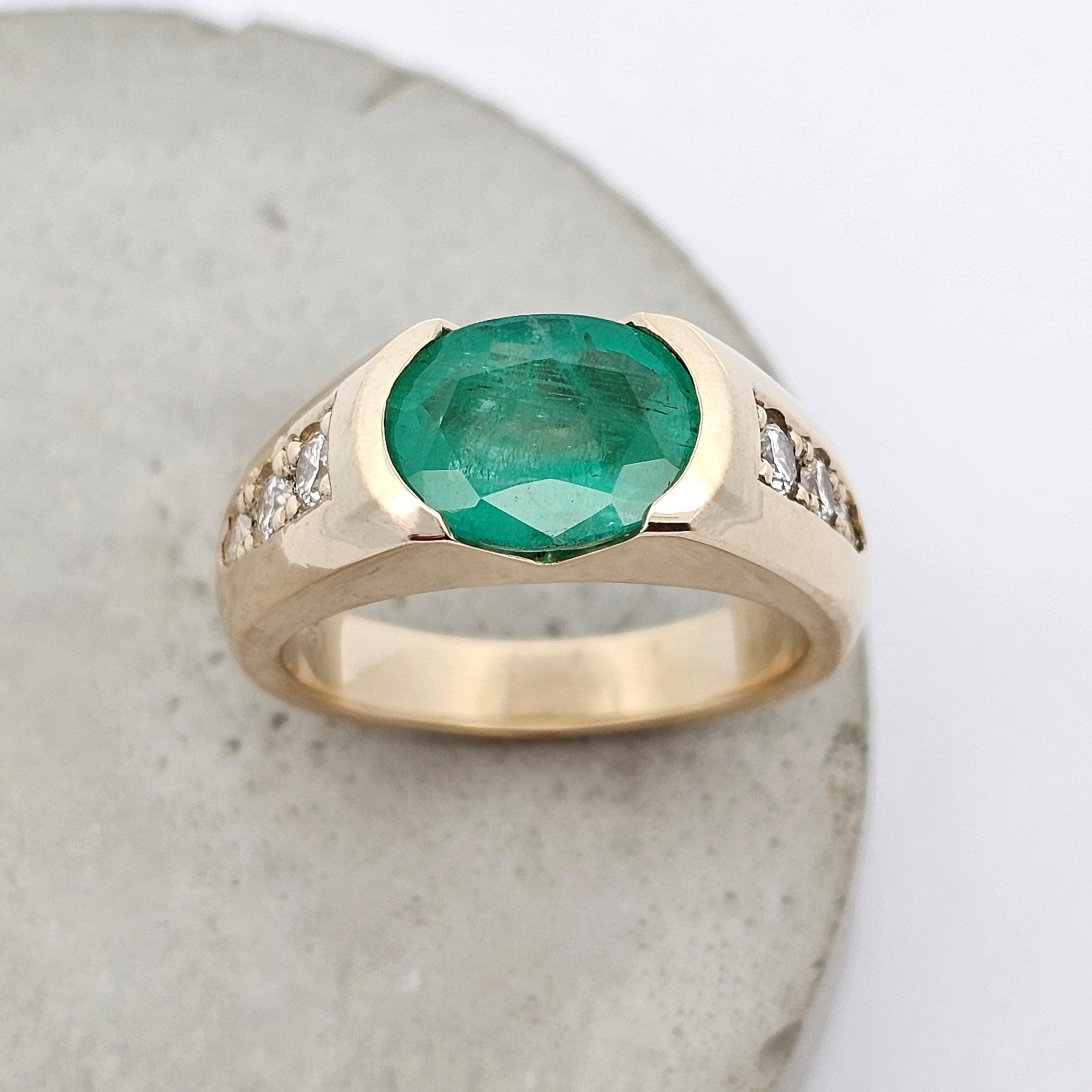yellow gold emerald and diamond anniversary ring 