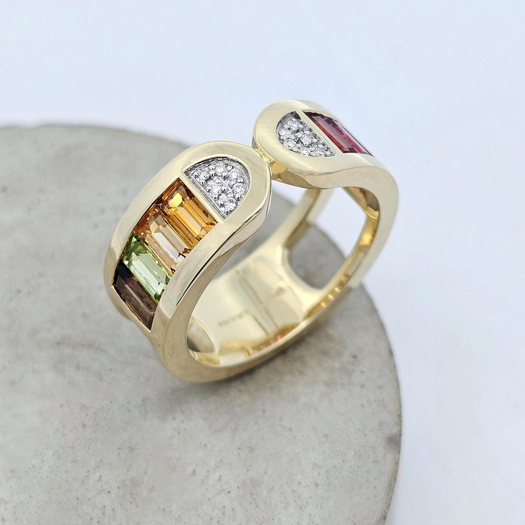 Colour Stack yellow gold ring with multicoloured baguette gemstones and natural diamond accents. Cool Side.