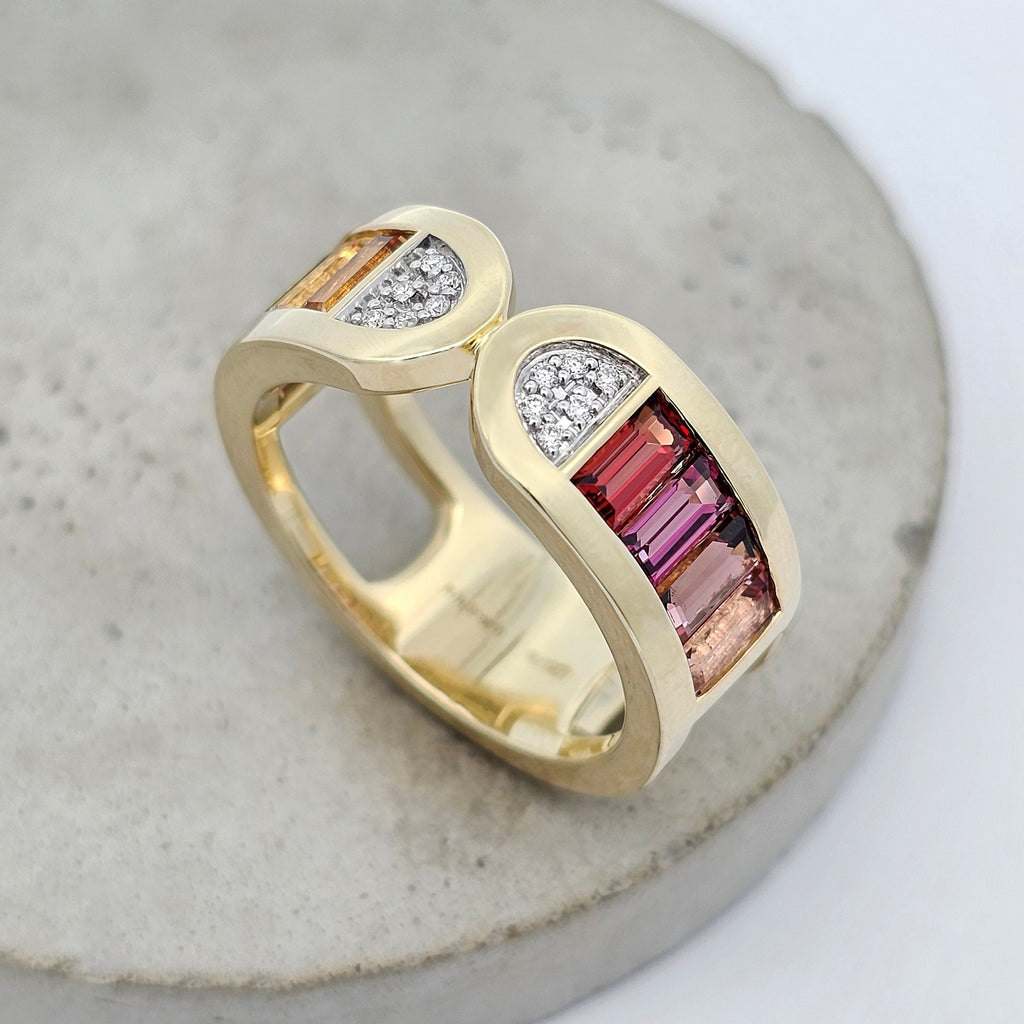 Colour Stack yellow gold ring with multicoloured baguette gemstones and natural diamond accents. Warm side.