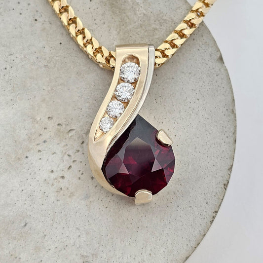 yellow and white gold African garnet and diamond pear drop pendant
