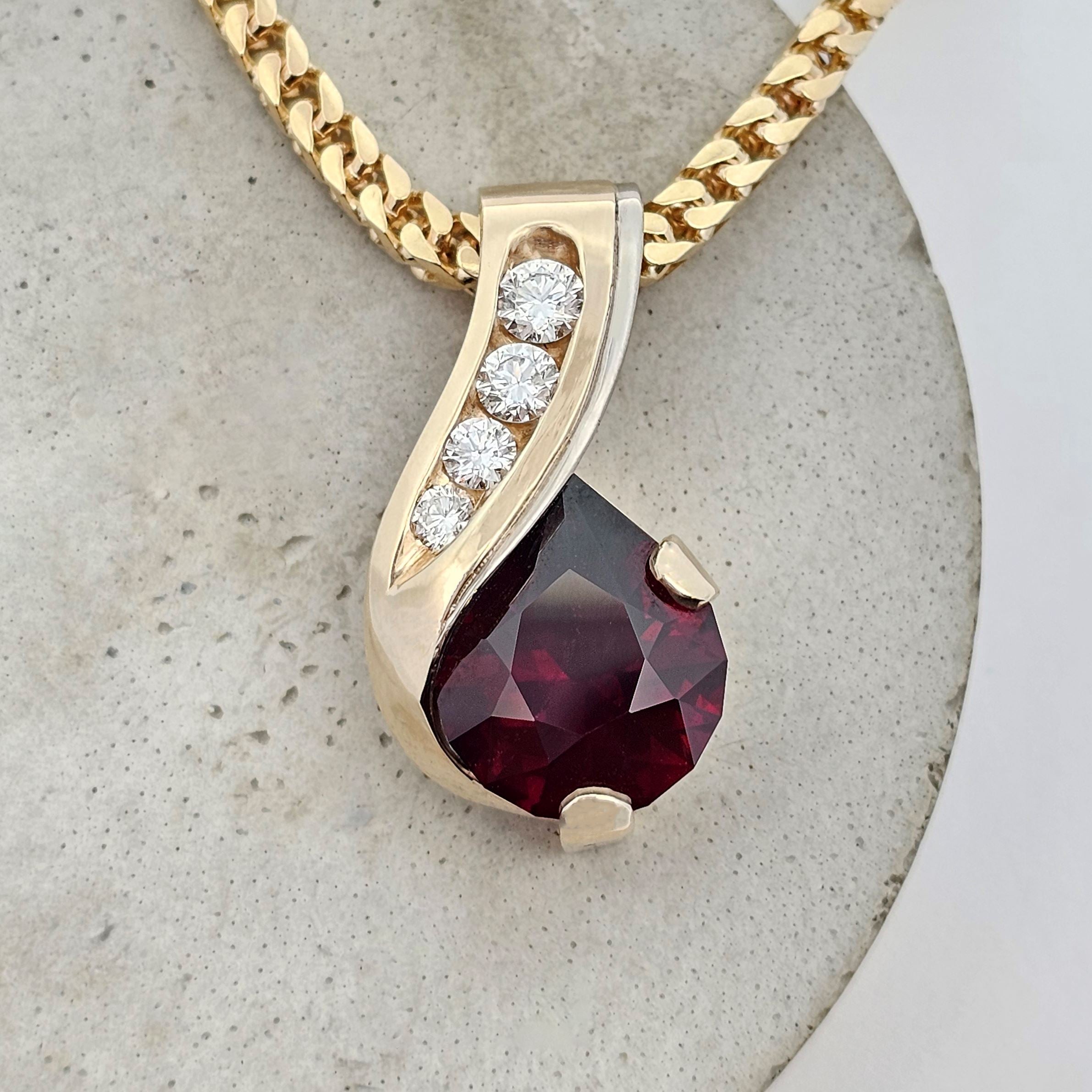 yellow and white gold African garnet and diamond pear drop pendant 