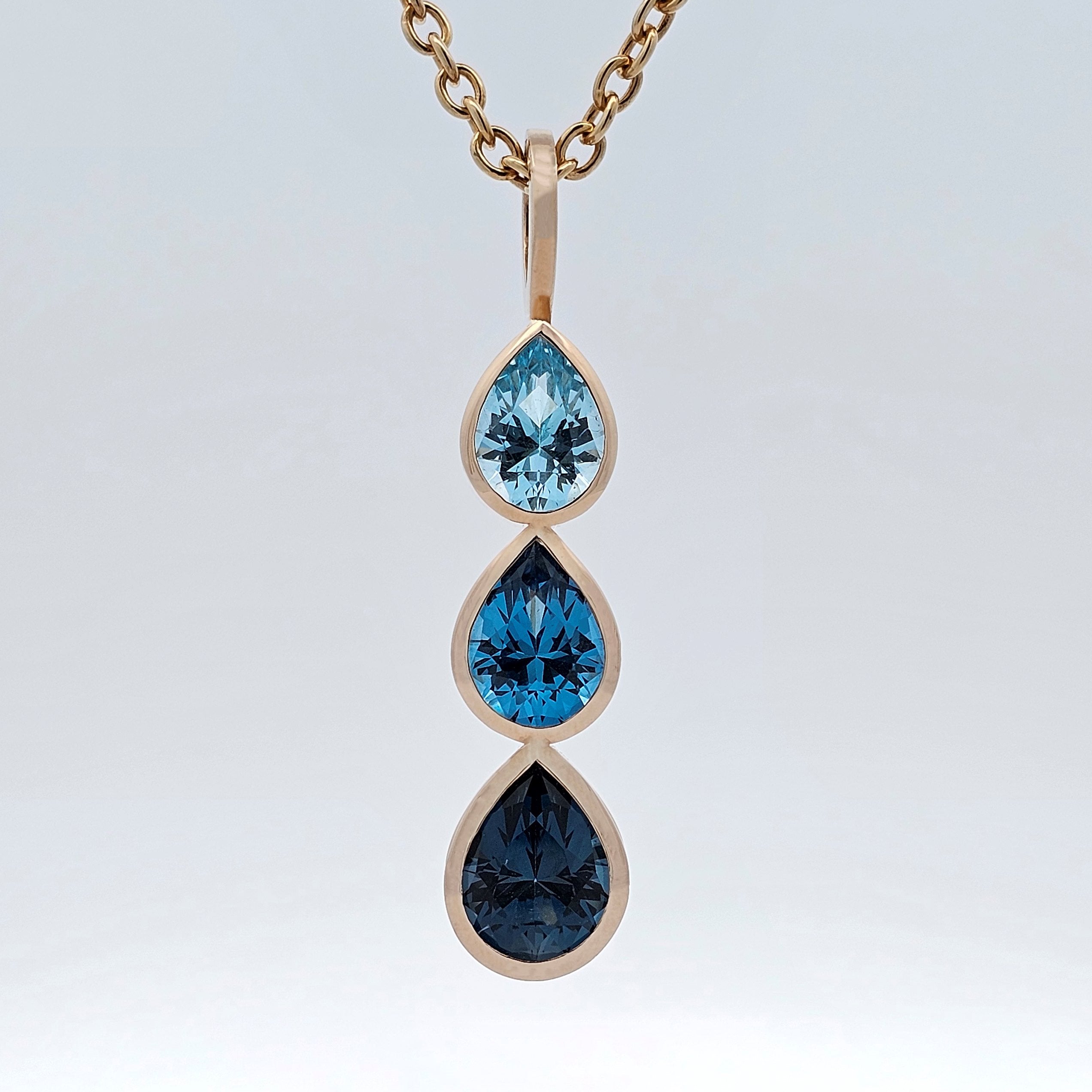 yellow gold blue topaz raindrop pendant 