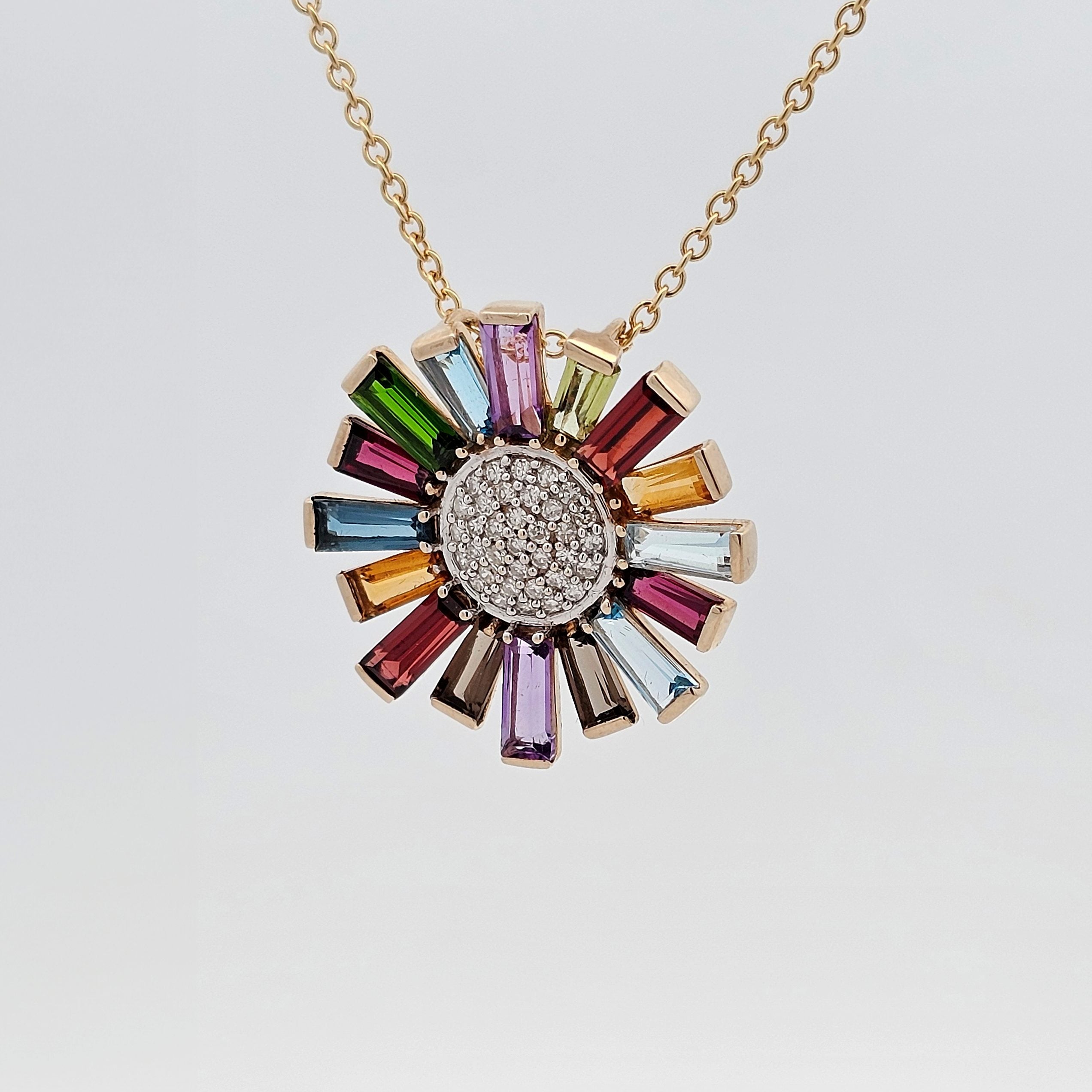Rainbow gemstone sunburst pendant featuring baguette-cut stones and a round diamond-pavé centre.