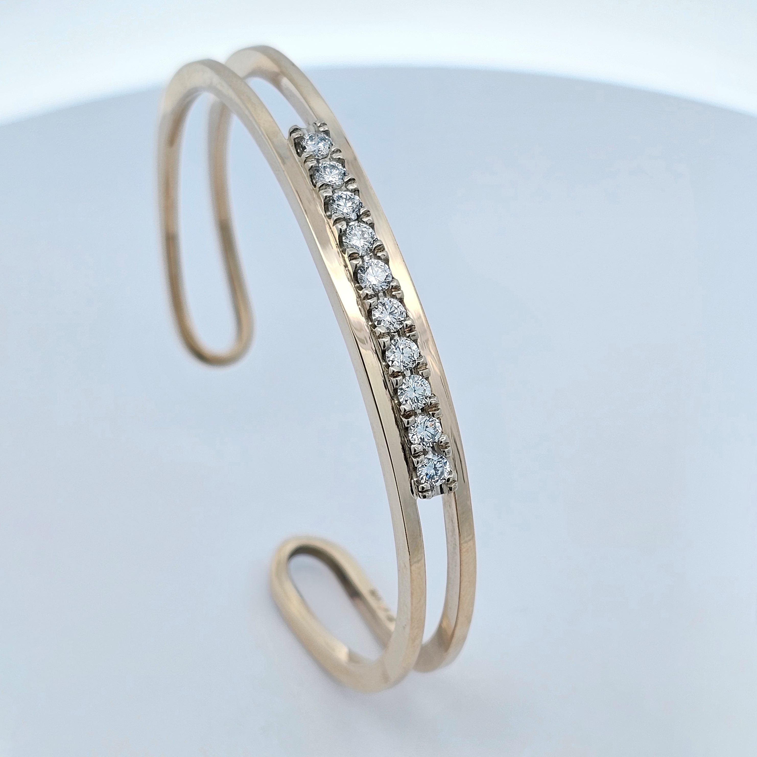 yellow gold claw-set one carat diamond fitted cuff bangle 